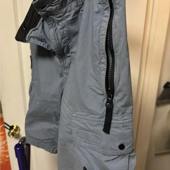 Stone Island Light Blue Cargo Shorts with Badge